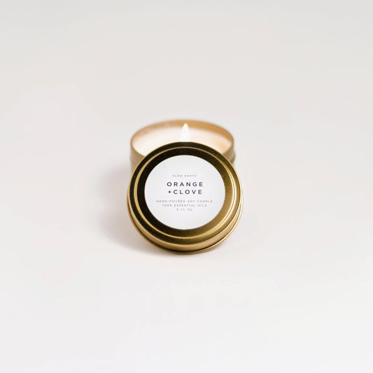 Orange + Clove soy wax candle in 6 ounce gold travel tin by Slow North