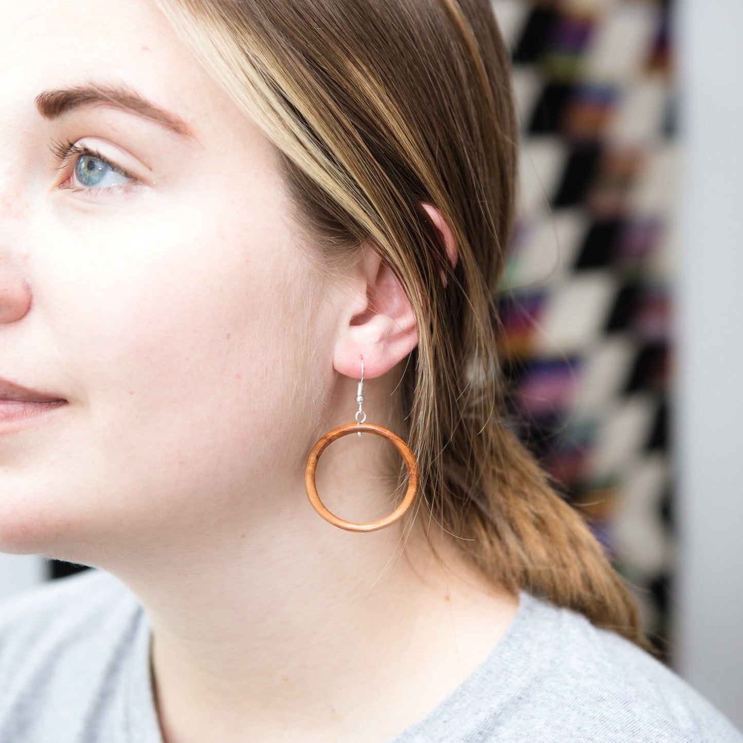 Model Wearing Fair Trade Wood Hoop Earrings 