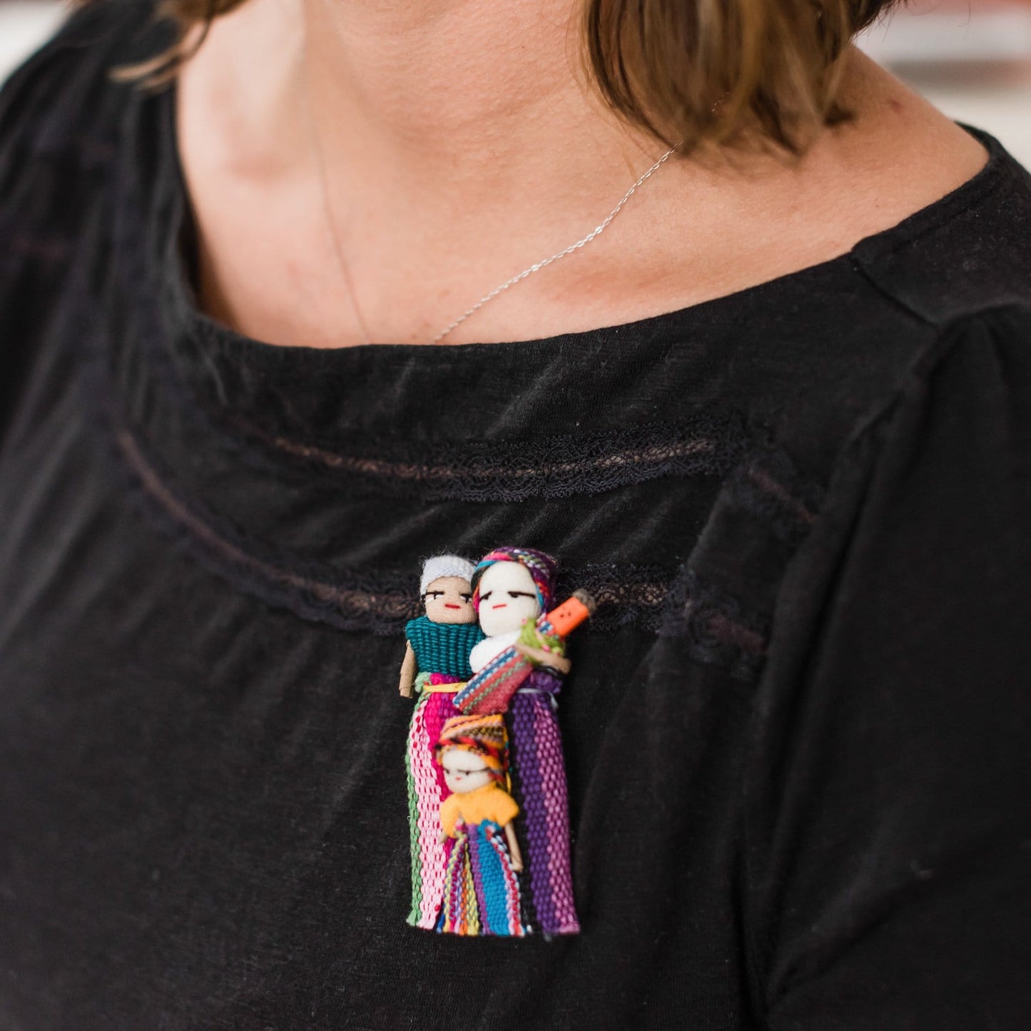 Model Wearing Fair Trade Migrant Family Pin