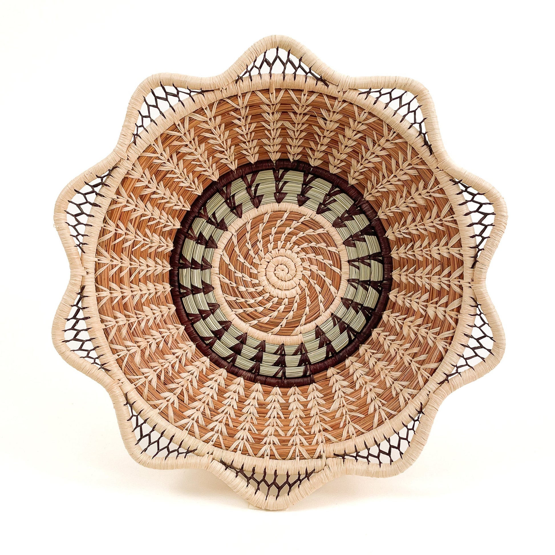 Pine needle handmade basket with traditional designs - top view