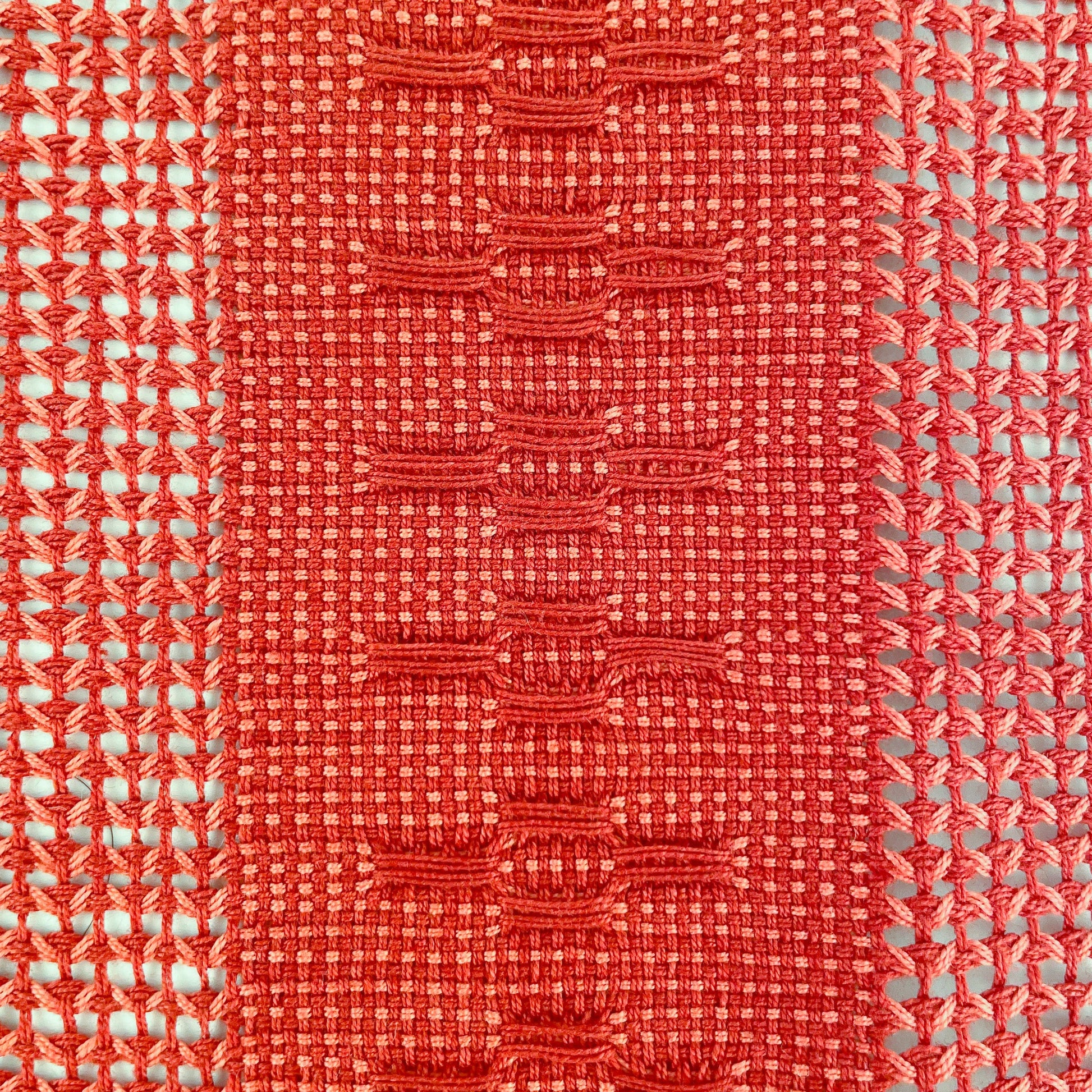 Closeup of view of Calado Table Runner in Terracotta, showing detail of calado pattern