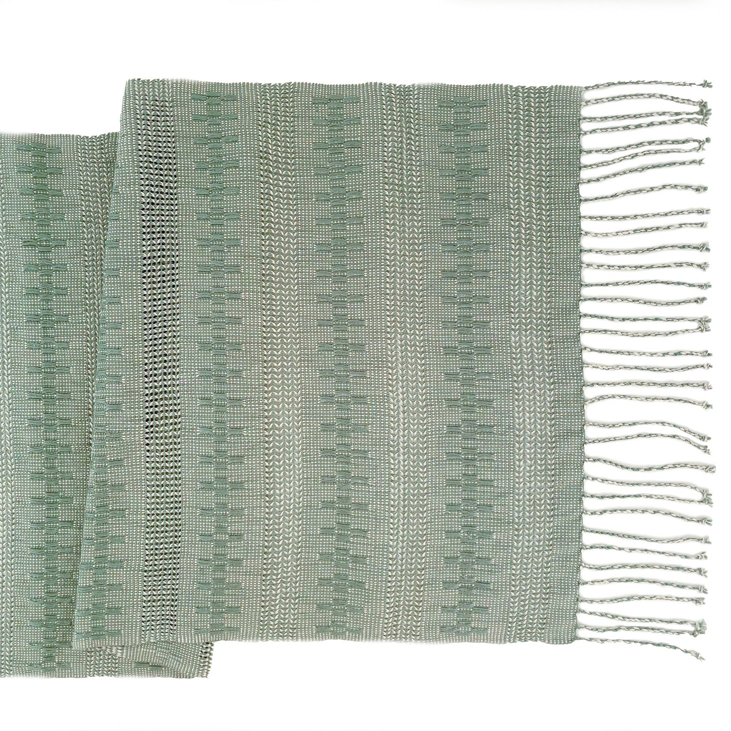 Overhead view of the Calado Table Runner in Sage with twisted fringe