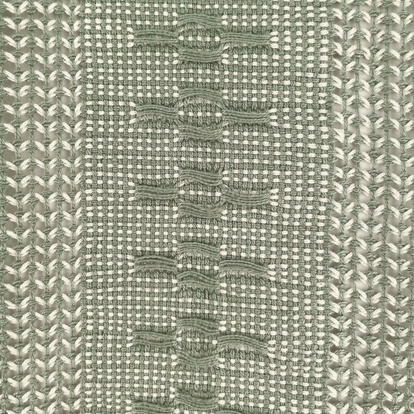 Closeup of view of Calado Table Runner in Sage, showing detail of calado pattern